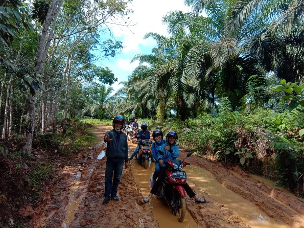 A group of people on motorcycles on a dirt path in the woods

Description automatically generated with medium confidence